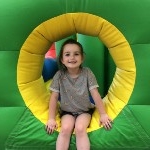 student on bounce house